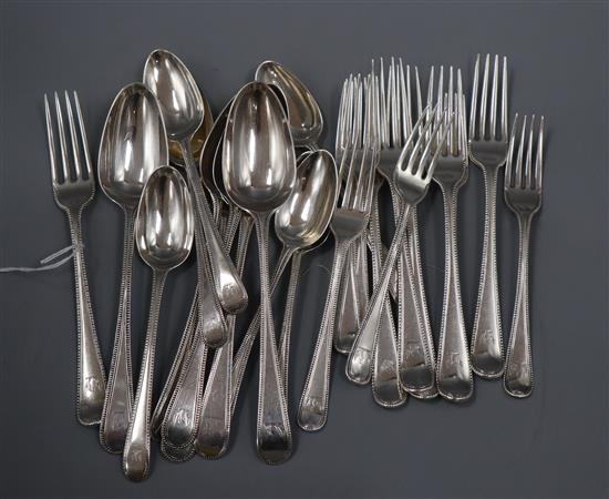 A harlequin part canteen of 18th and 19th century silver Old English beaded pattern flatware, 38.5 oz.